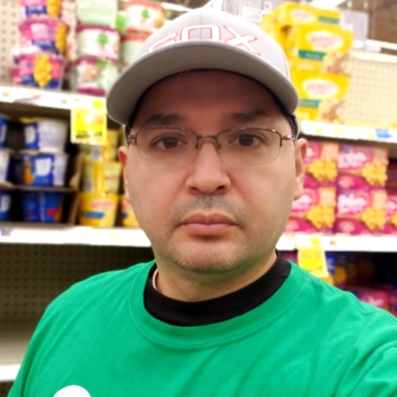 Portrait of Willy Solis in a grocery store