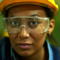 Close-up of face of a worker in goggles and hardhat