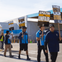 Amazon workers organized with Teamsters Local 63 march in a strike picket line carrying signs that read 'Amazon ULP Strike' Photo Credit: Teamsters Local 63