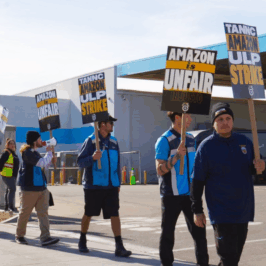Amazon workers organized with Teamsters Local 63 march in a strike picket line carrying signs that read 'Amazon ULP Strike' Photo Credit: Teamsters Local 63