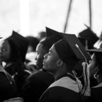 Young Black graduates attending graduation.